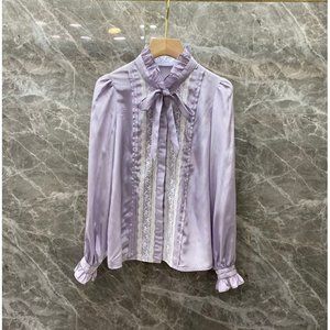 Lace blouse with flared sleeves